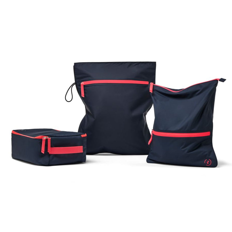 3 gym bags in navy and neon pink including the sweat bag, kit bag, and shoe bag