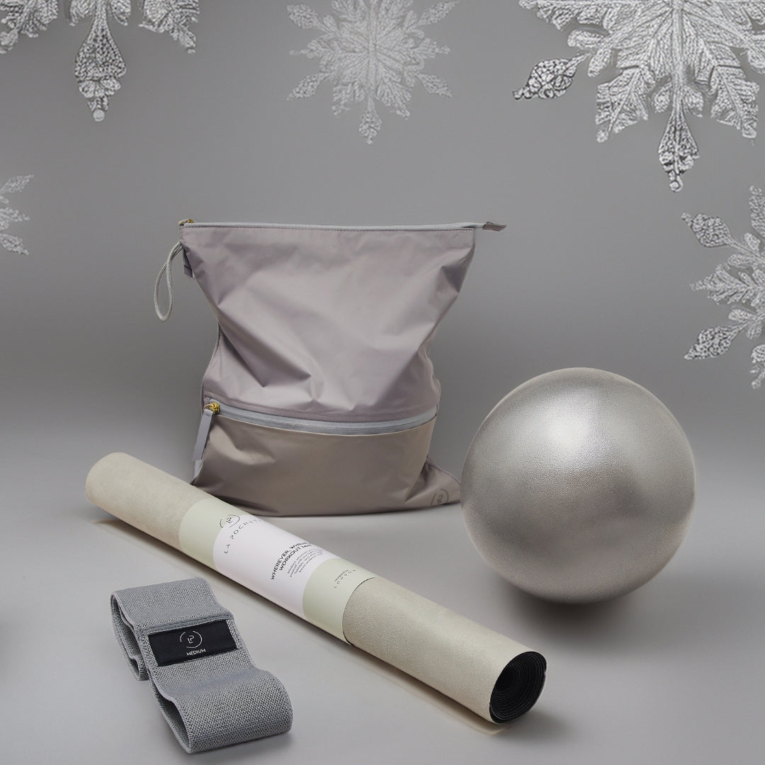 A mat, pilates ball, resistance band and Sweat Bag from La Pochette