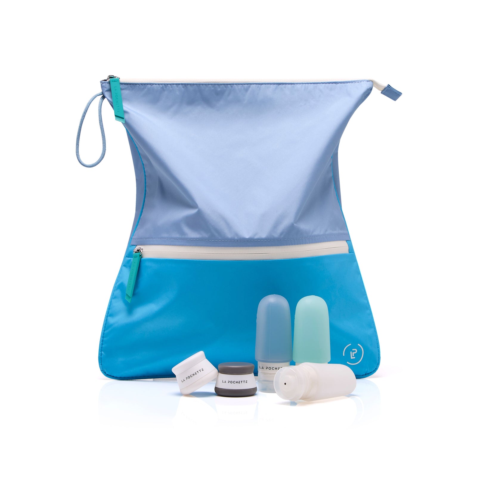 vivid blue sweat bag styled with the three travel bottles in turquoise and the La Pochette travel pots
