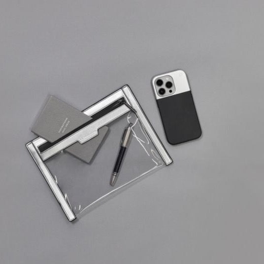 Anywhere Everywhere clear wallet in silver and black with pen and pad inside, and phone by the side