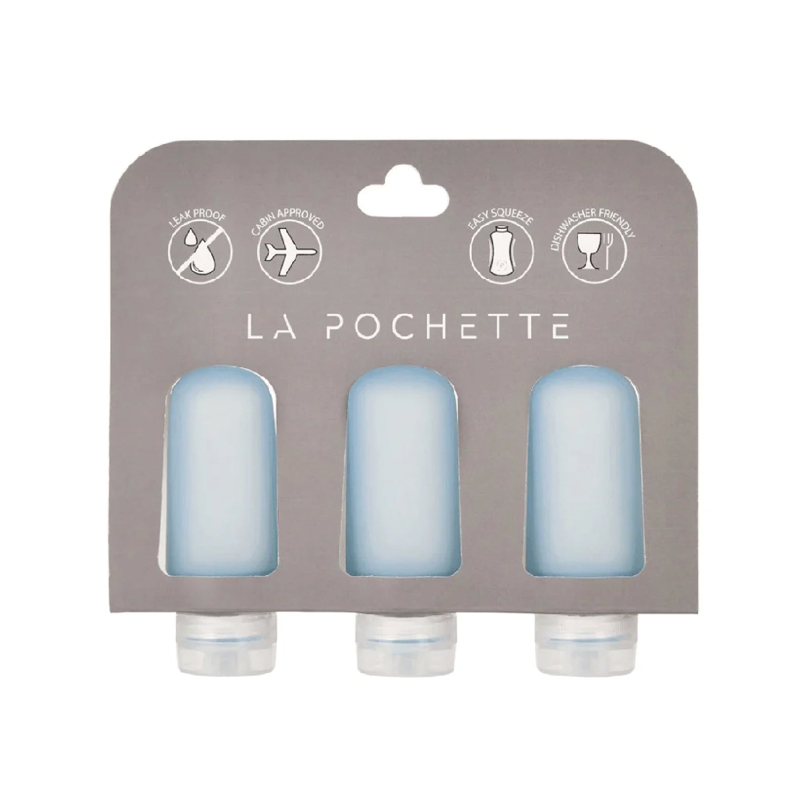 Set of three refillable silicone travel bottles, in blue, displayed in La Pochette packaging