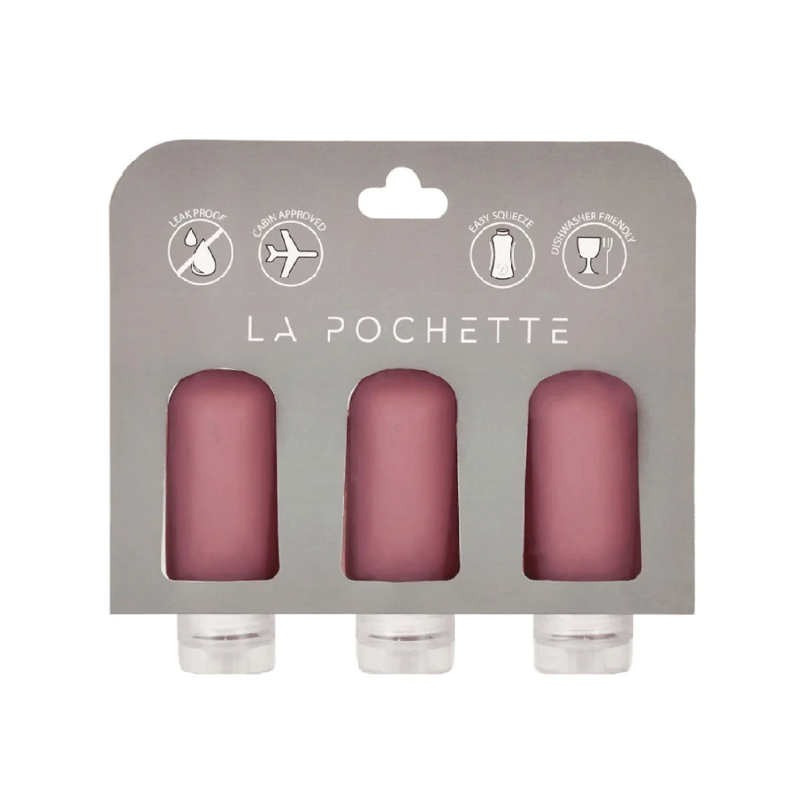 Set of three refillable silicone travel bottles, in burgundy, displayed in La Pochette packaging.