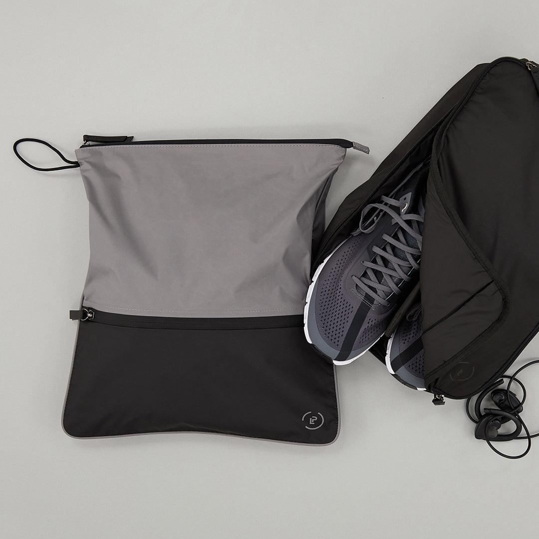 Large Shoe carry in Ink colourway with shoes inside next to Sweat Bag in Pewter Ink colourway