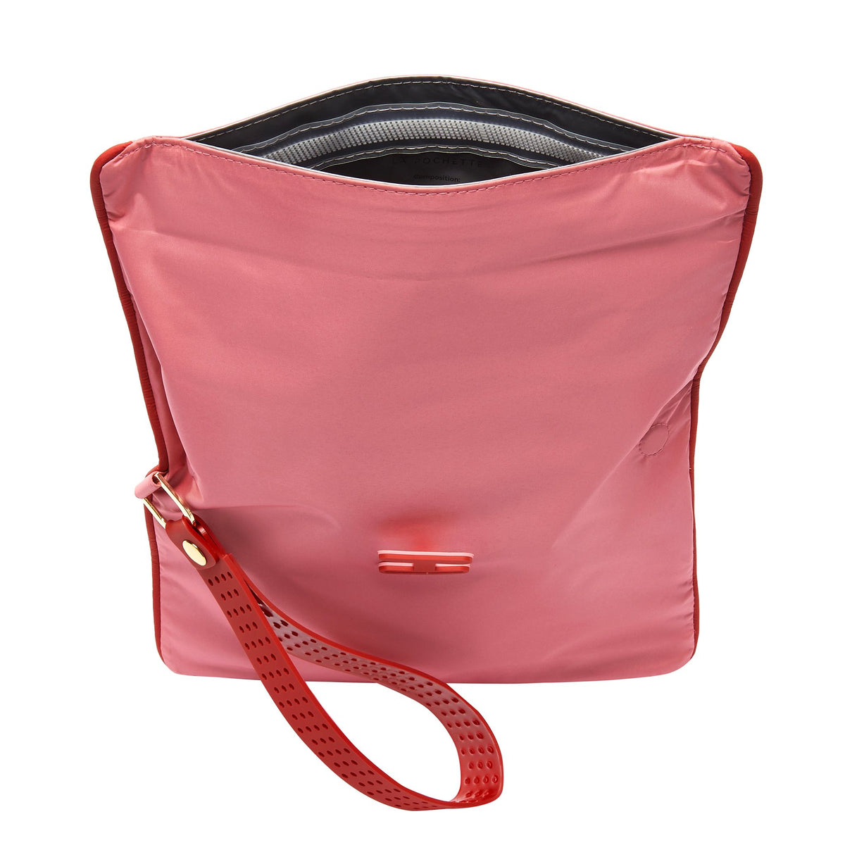 Small wet bag in Peony and Chilli open, and showing waterproof lining 