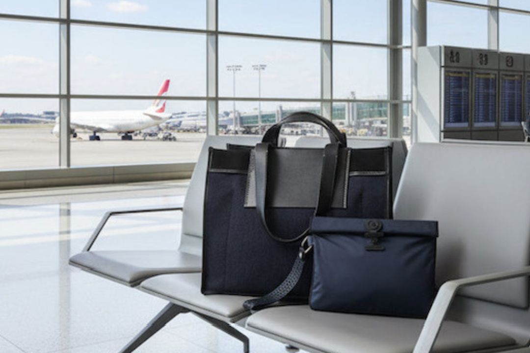 Wet Bag and Carry on bag on an airport chair