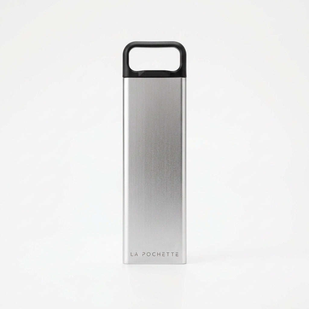 A La Pochette branded stainless steel supplement box on a white backdrop