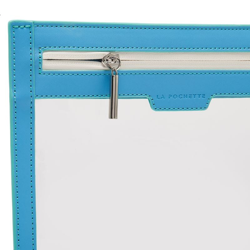 close up of white zip  on La Pochette clear travel wallet with turquoise trims.