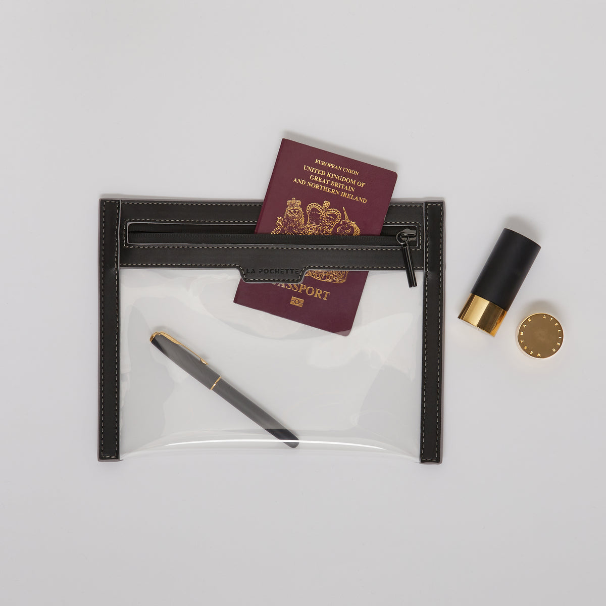 Anywhere Everywhere Wallet holding a passport and other beauty products