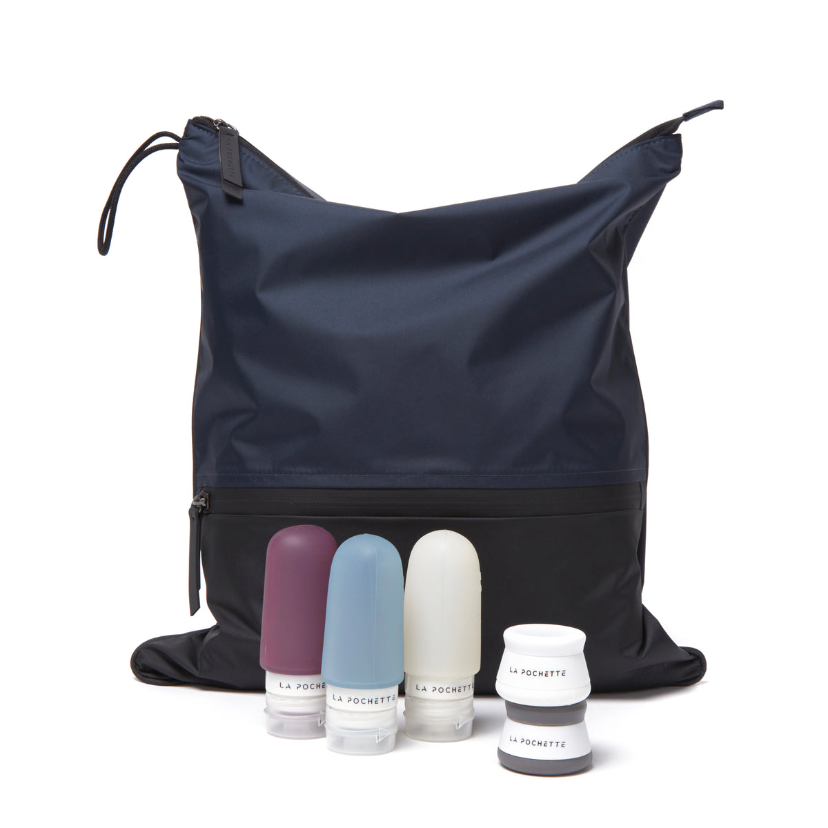 Travel Bottle Trio with travel pots next to Sweat Bag in Midnight Ink colourway 
