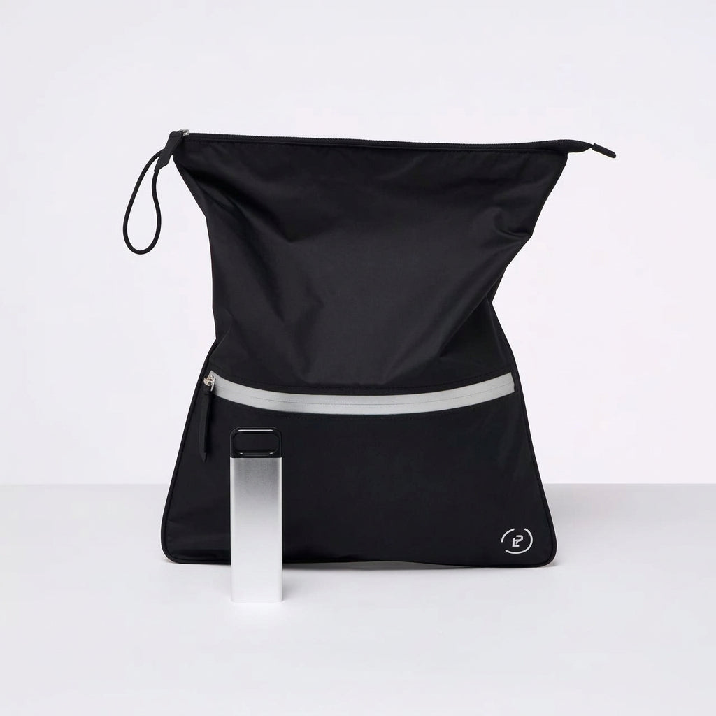 A Black La Pochette antimicrobial sweat bag with silver zip, shown with a 3 day stainless steel supplement box. On a white background
