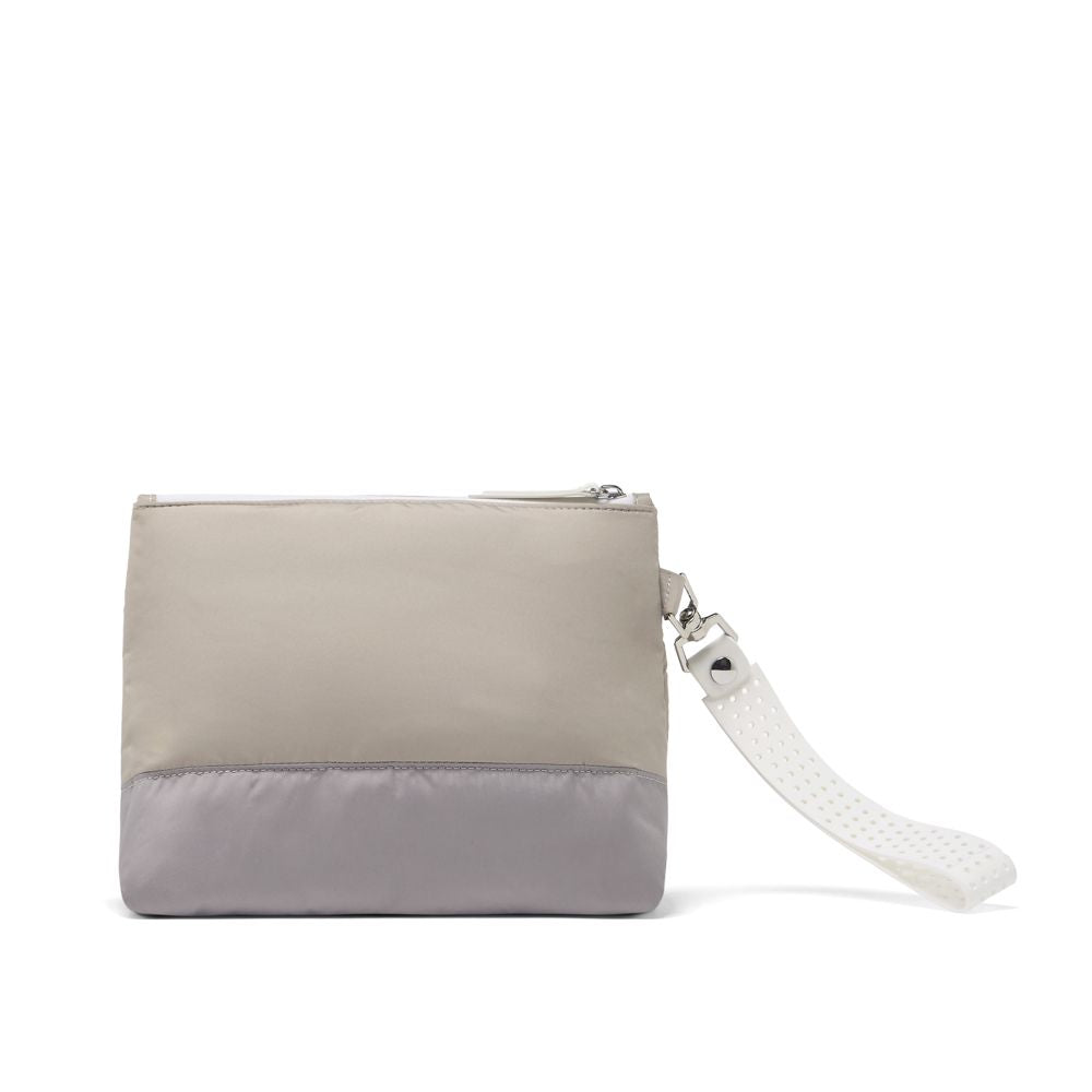 Two-tone beige and gray clutch bag with a strap on a white background