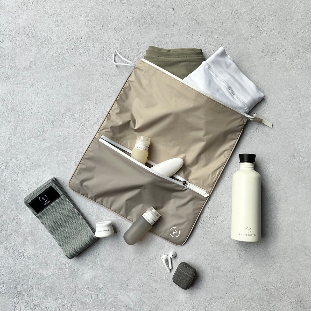sweat bag with resistance band, water bottle and travel bottles