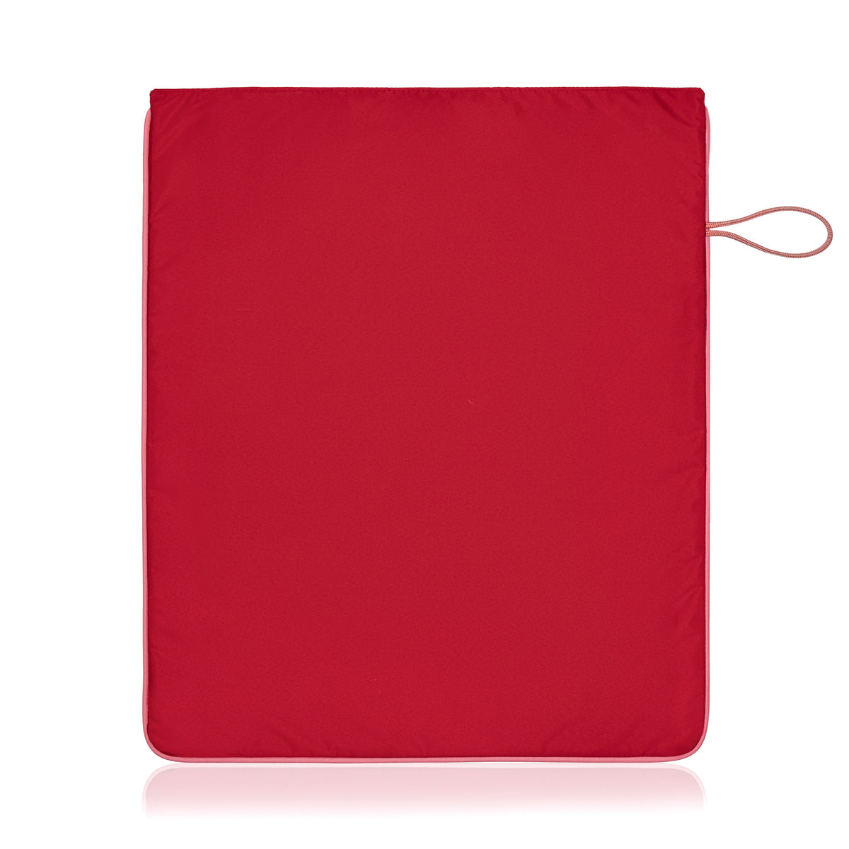 The back of a waterproof bright red La Pochette kit bag with peony pink trims. Showing pink side hanging loop. Shown on a white background.