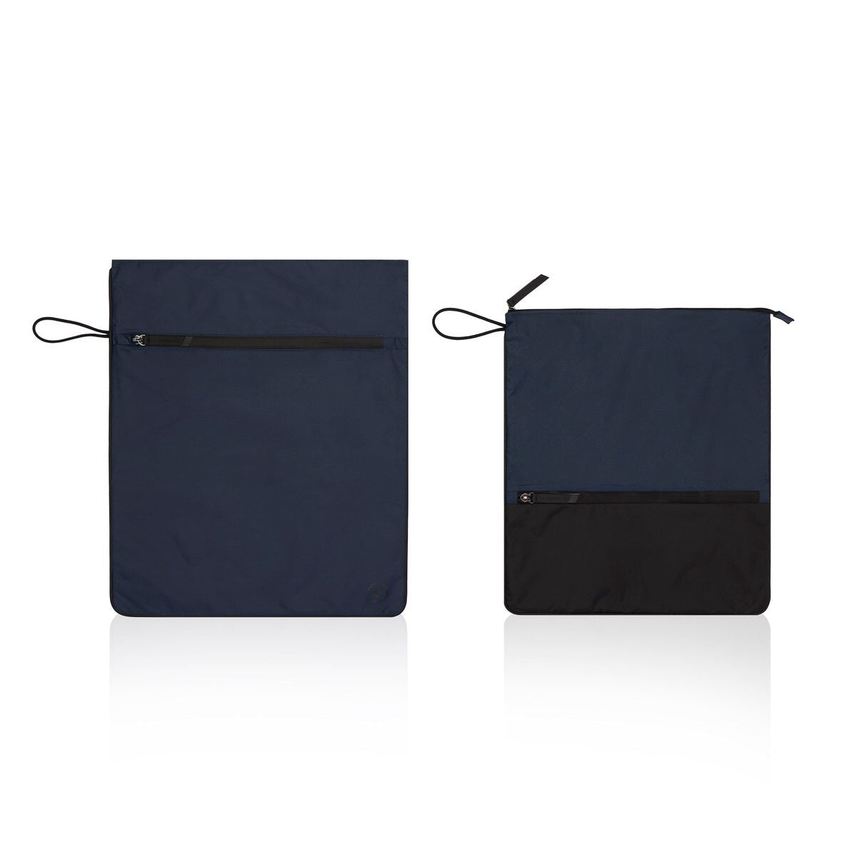 Navy Kit Bag with smaller black and navy Sweat Bag side by side, showing the size comparison 