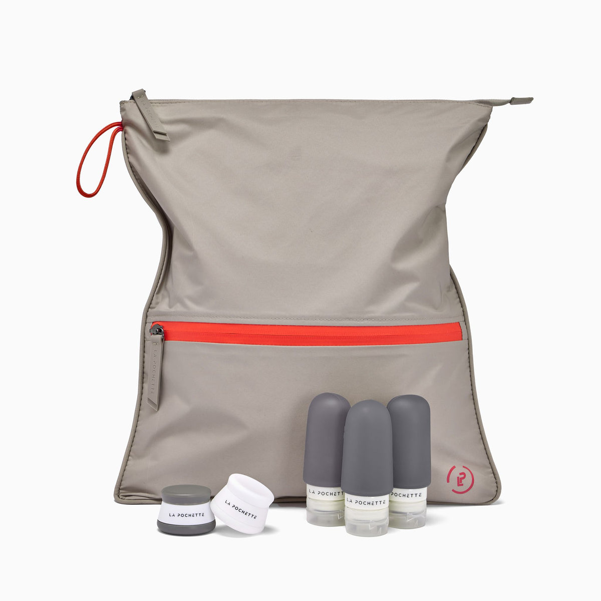 la Pochette Taupe Sweat Bag with red trims, together with 3 grey silicone travel bottles and 2 small pots
