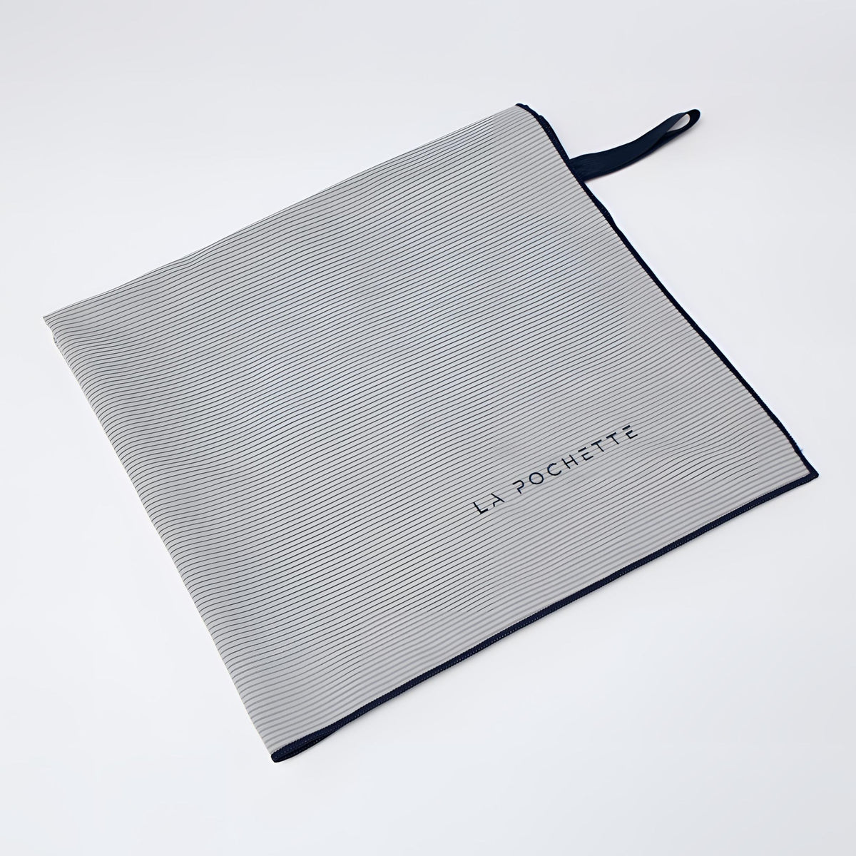 A grey highly absorbent microfiber towel with a dark navy trim, and a matching navy loop handle. The brand name 'LA POCHETTE' is printed in navy on the front, set against a clean white background.