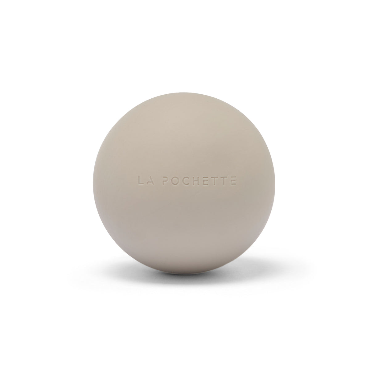A matte beige spherical massage ball with the brand name 'LA POCHETTE' embossed on the front, set against a clean white background with a soft shadow.