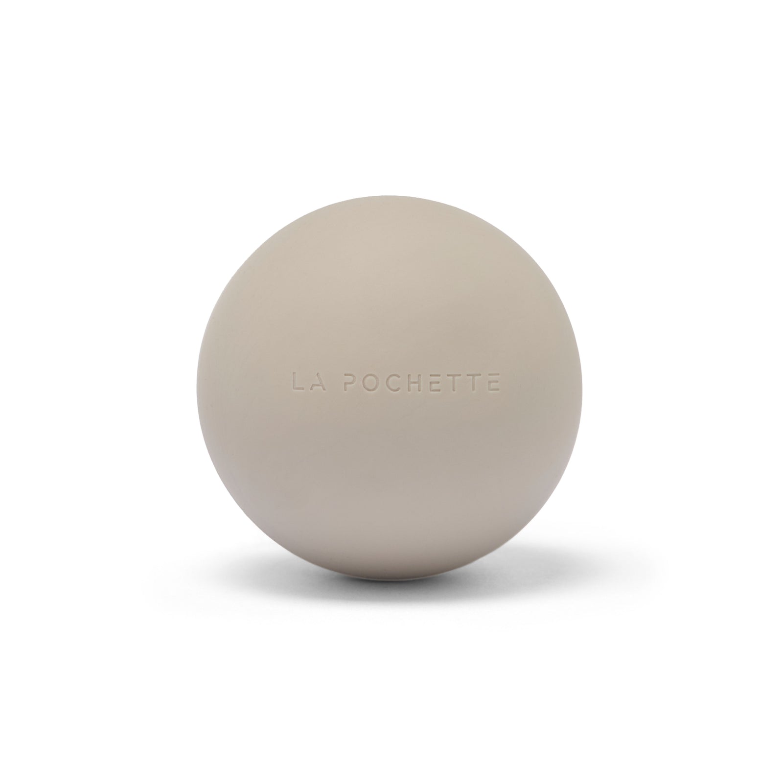 A matte beige spherical massage ball with the brand name 'LA POCHETTE' embossed on the front, set against a clean white background with a soft shadow.