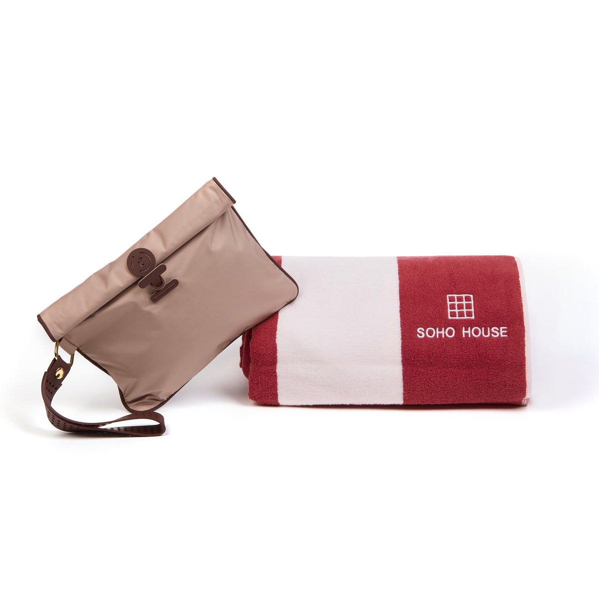 Small Wet Bag in Rose Oxblood colourway leaning on folded Soho House towel  