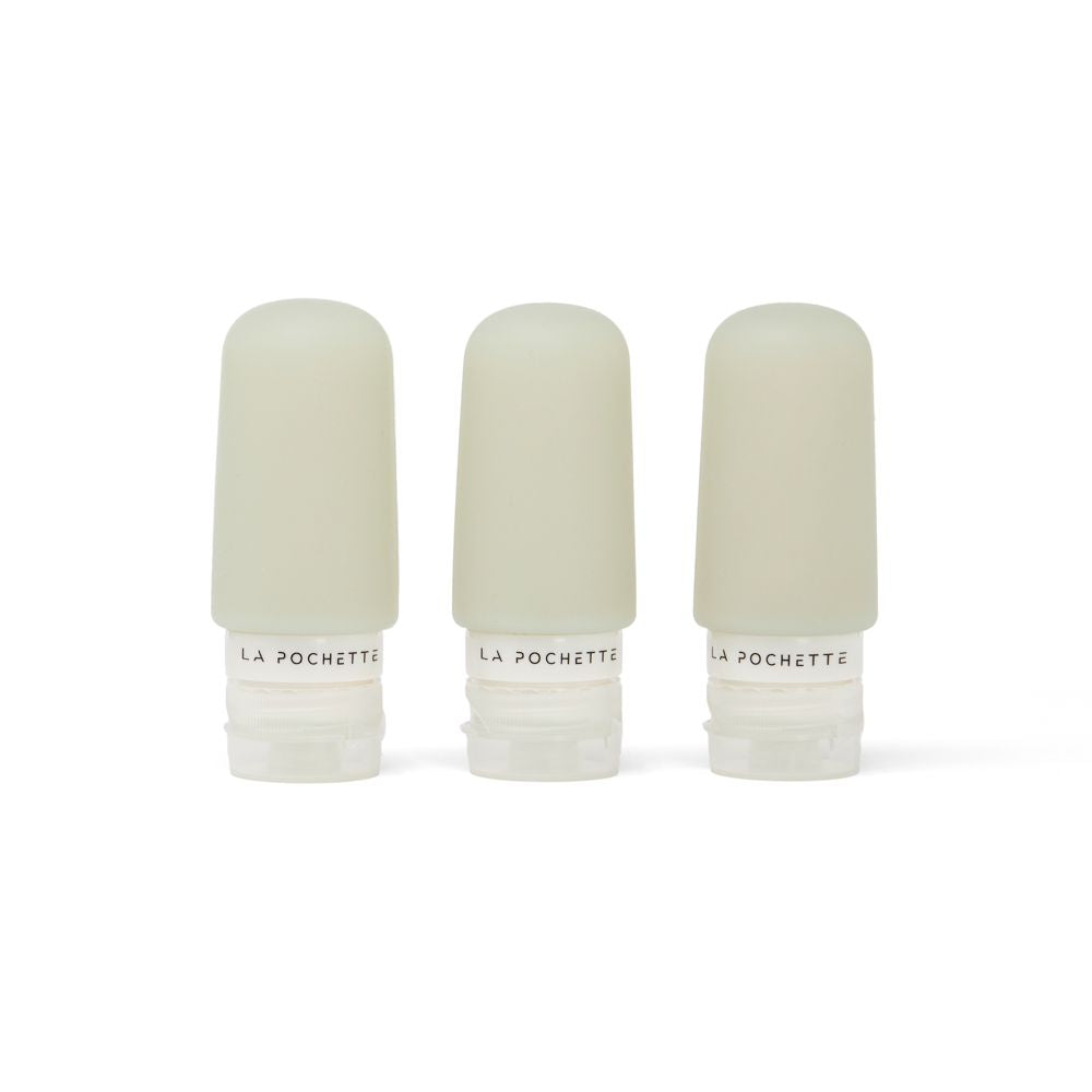 Set of three refillable, leak-proof silicone travel bottles in sage green