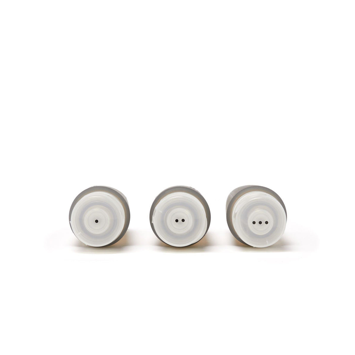 La Pochette Travel Bottles Trio showing the dot indicators on the lids