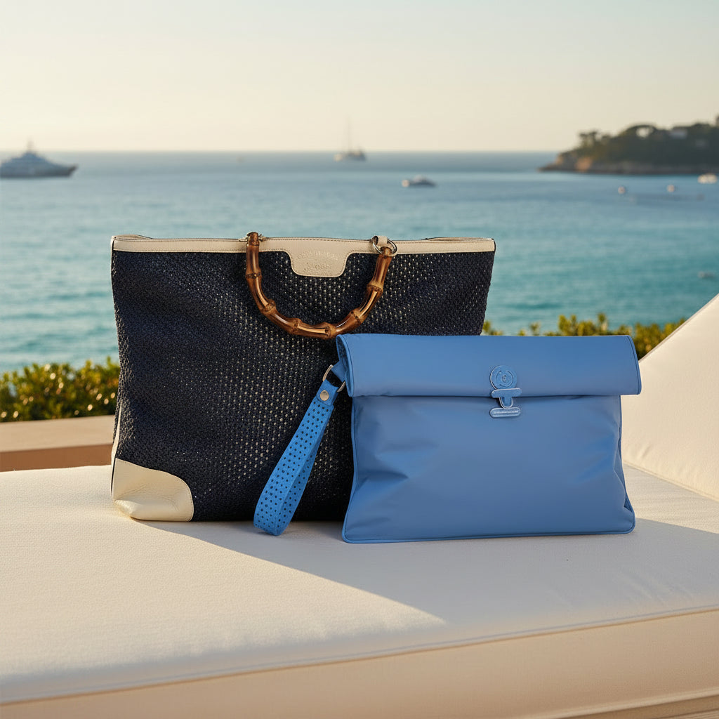 A La Pochette Maxi waterproof Wet bag in bright blue, with a navy handbag on a sunlounger in the Riviera