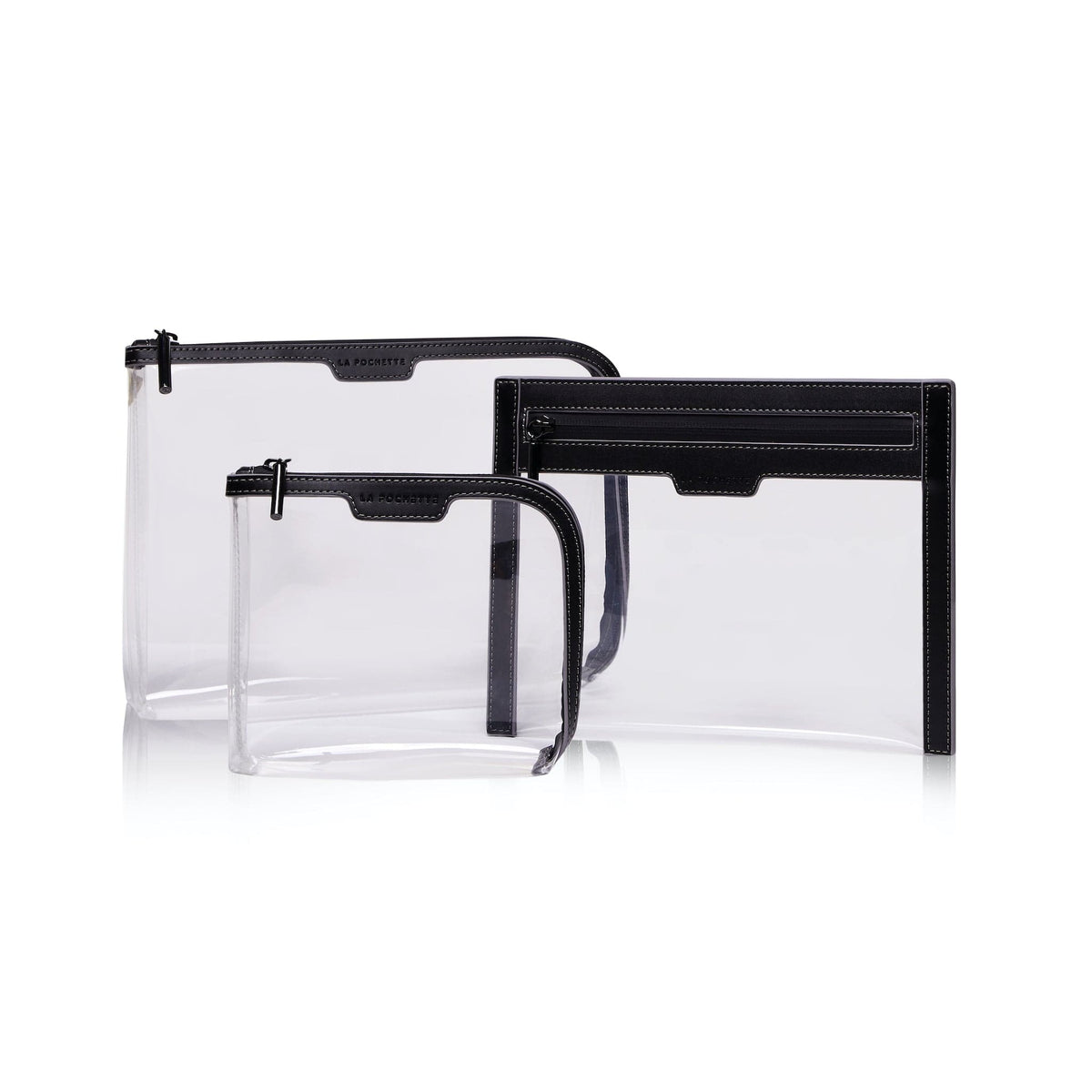 A collection of 3 cabin approved La Pochette clear travel pouches with black and grey trims and black zips. Include s a small pouch, large pouch and wallet.
