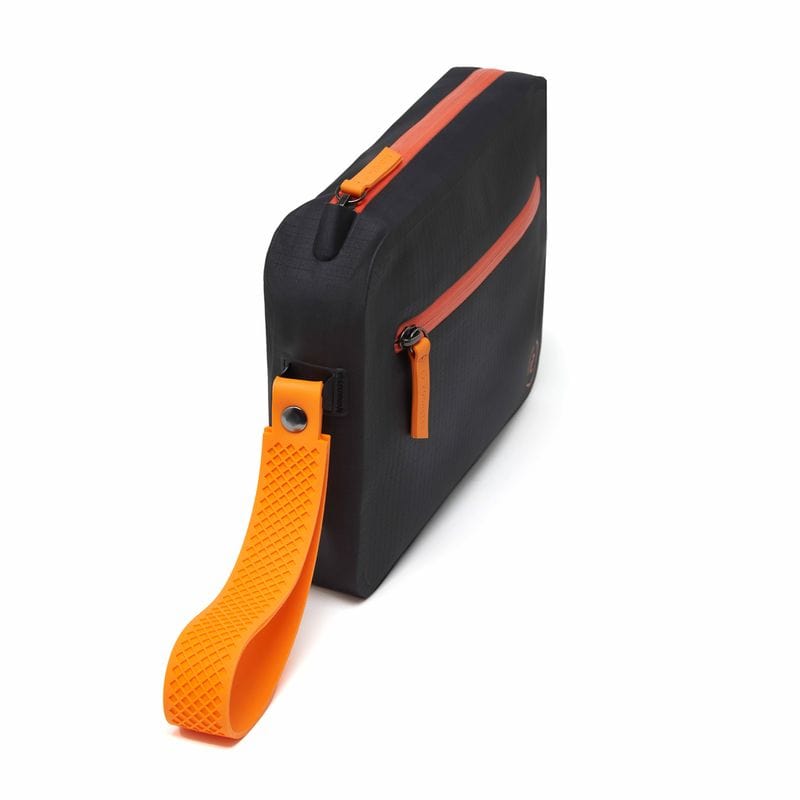 Side view of black aqua bag with orange waterproof zip and detachable wrist strap, showing slim profile and structure
