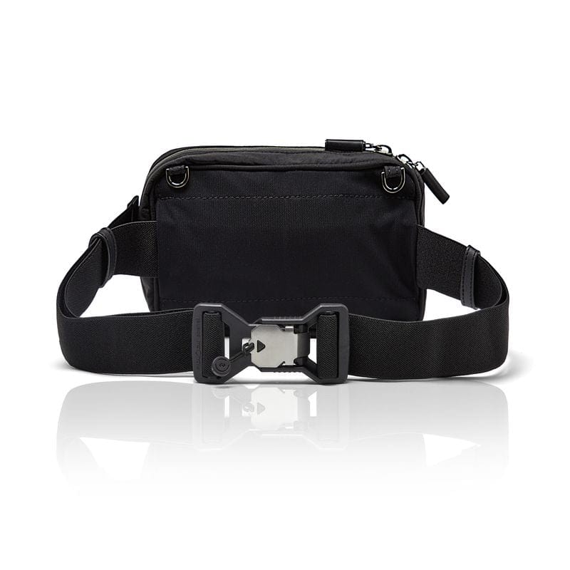 Belt bag in black shown from the back, showing the silver Fidlock clasp