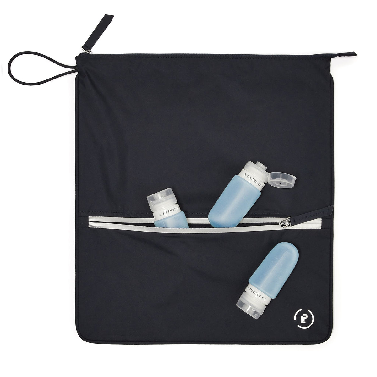Midnight Silver Sweat bag laying flat, with front pocket open showing La Pochette travel bottles 