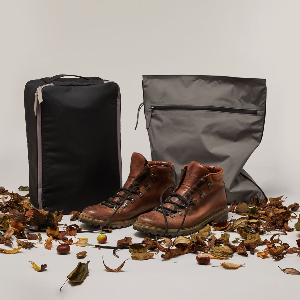 Large Ink Pewter Shoe Carry with Pewter ink Kit Bag.  A pair of walking boots are in front of the bags.