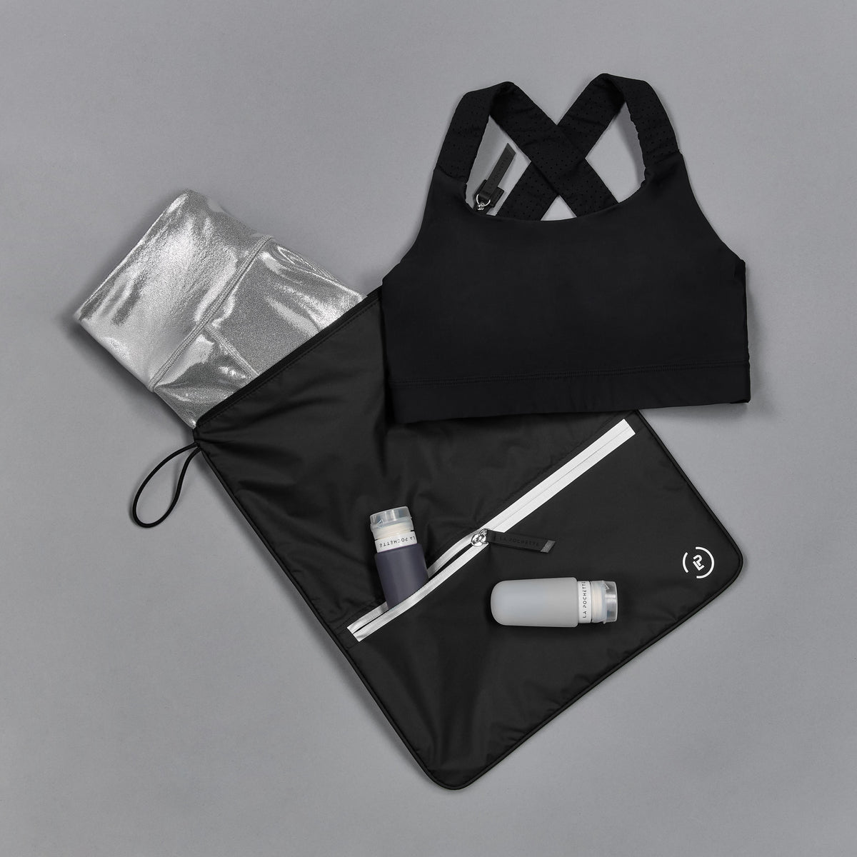 Sweat Bag shown with gym kit, and post workout essentials - lightweight bag for storing clean or dirty gym kit