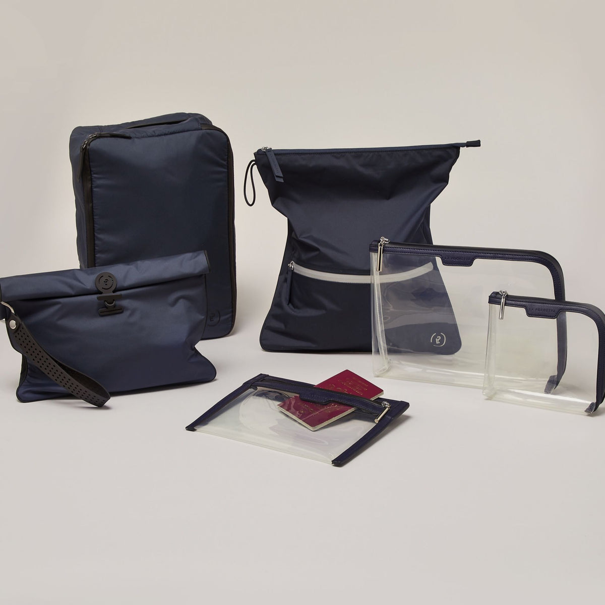A collection of Midnight Ink products including a Small Shoe carry, large wet bag, Anywhere everywhere wallet, small pouch and large pouch, and a midnight  silver sweat bag