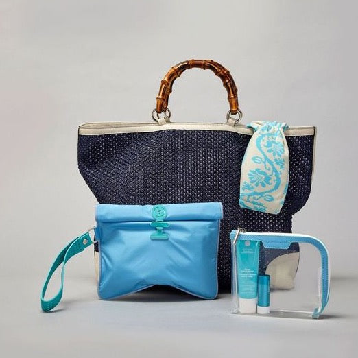 Mykonos small Wet Bag shown with basket and small Anywhere Everywhere pouch