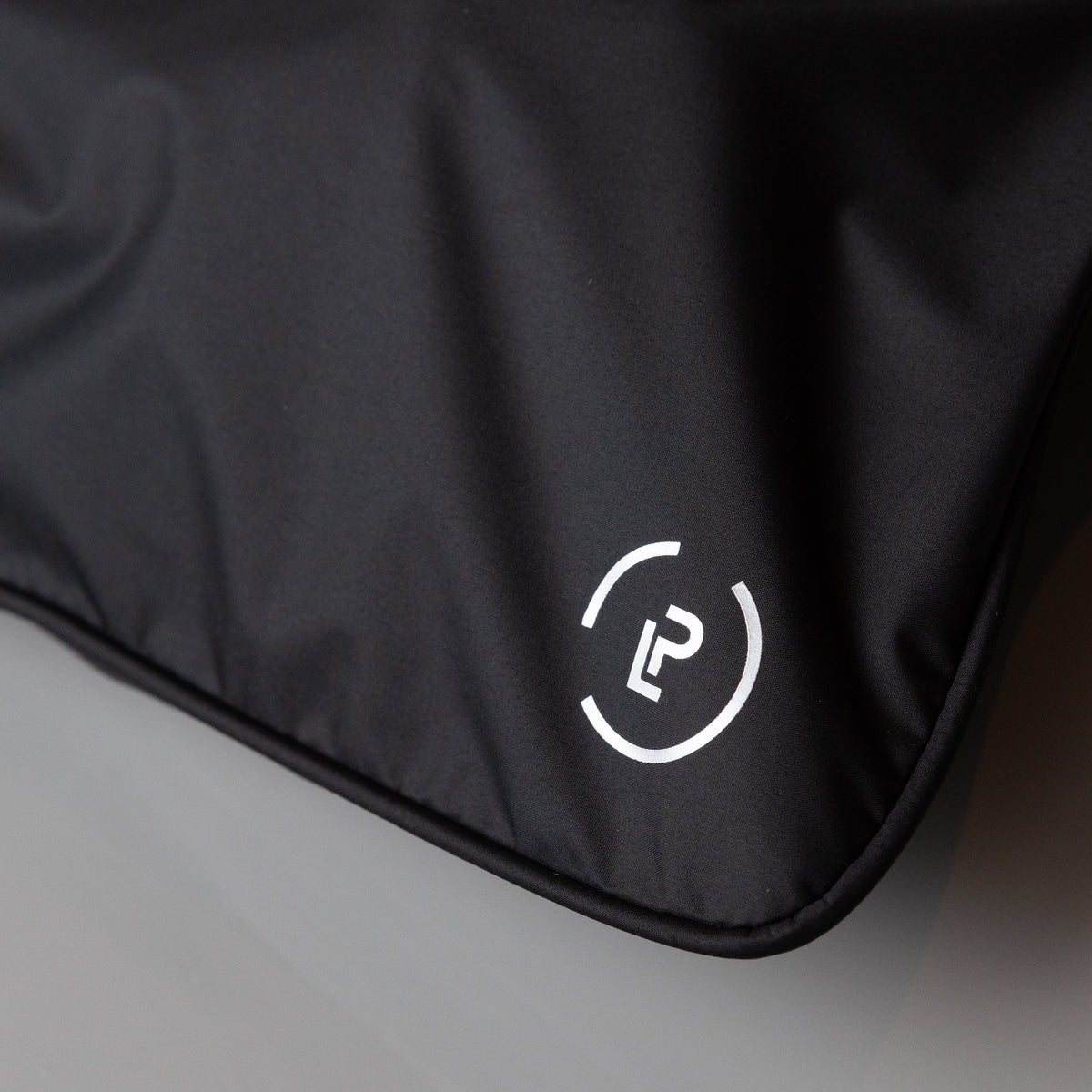 close up of La Pochette logo in silver 