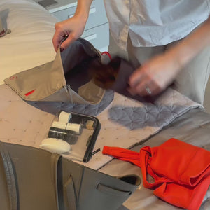 demonstration of using the sweat bag in beige and vivid red, packing it into a tote bag with other essentials, and showing it going into the washing machine after use