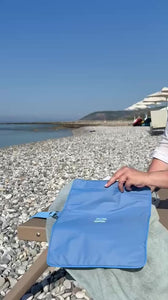 video packing riviera waterproof wet bag on the beach