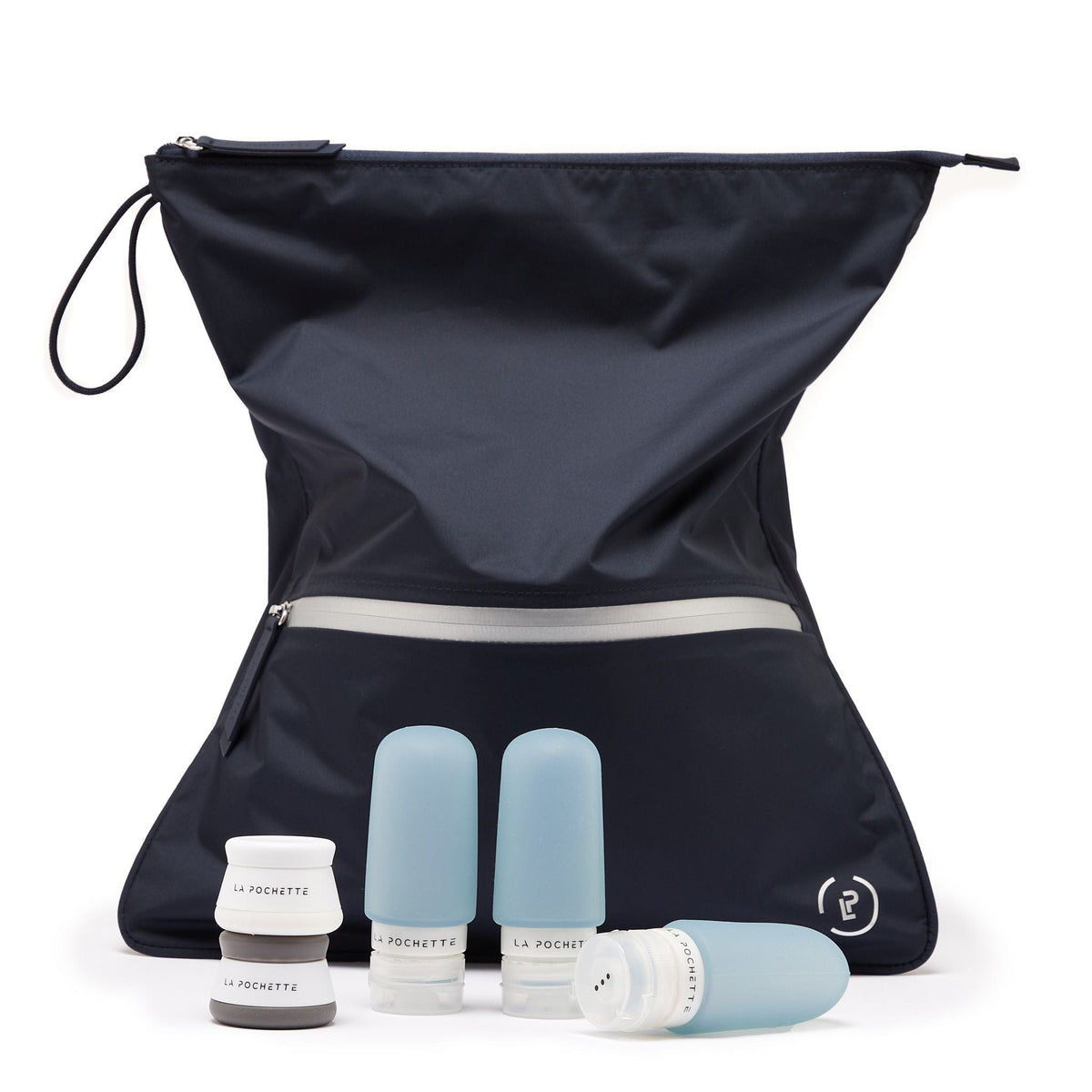 Navy sweat bag styled with the three travel bottles in blue and the La Pochette travel pots