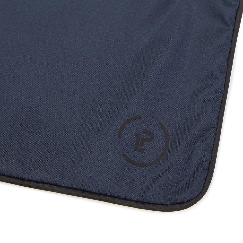 Close-up of navy Sweat Bag showing the black La Pochette logo detail