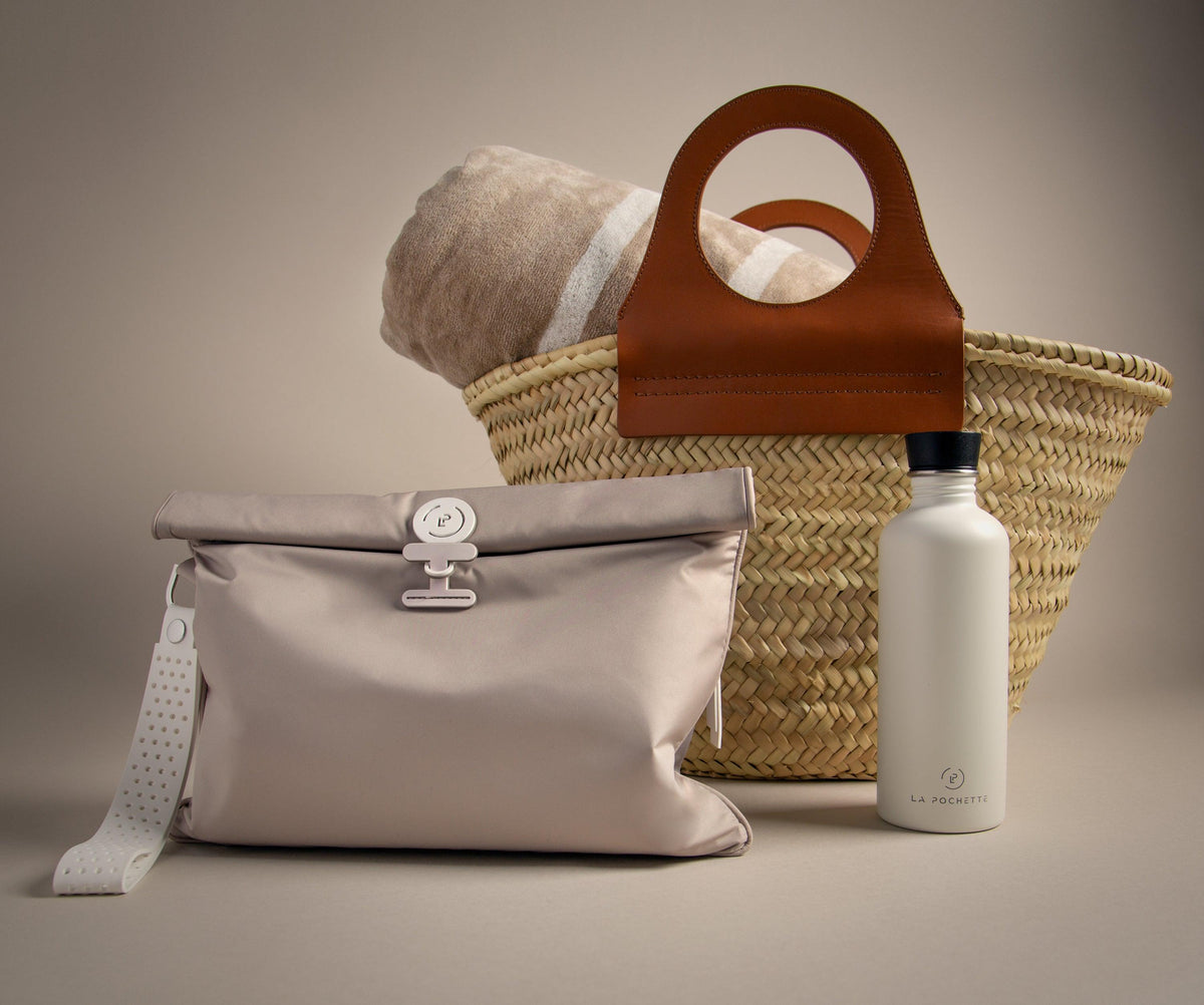 Large Wet Bag in Cashmere Walnut colourway lying against a Beach bag and La Pochette water bottle 