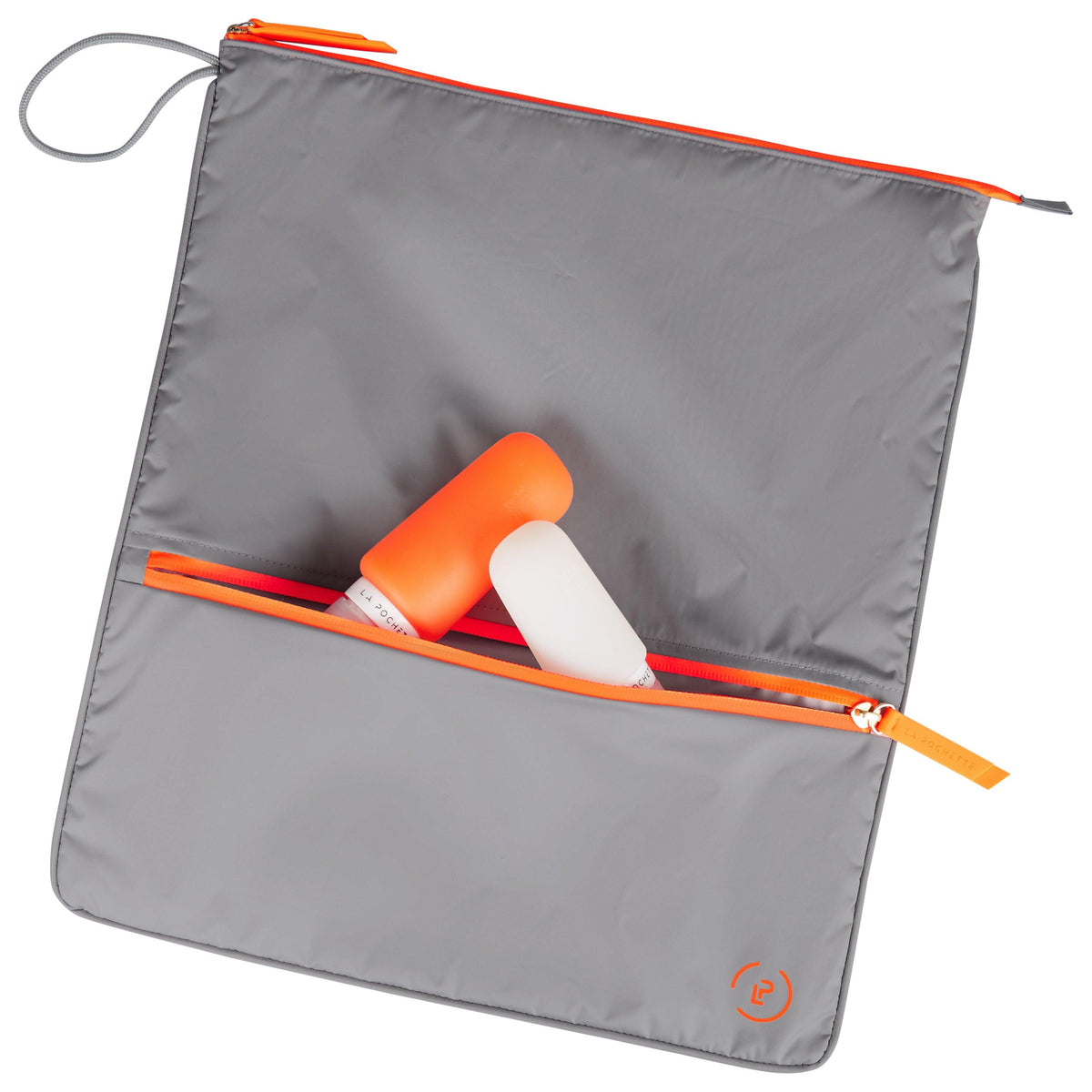 Shadow Neon Orange Sweat Bag, shown flat and with two La Pochette silicone travel bottles resting on top and in front pocket