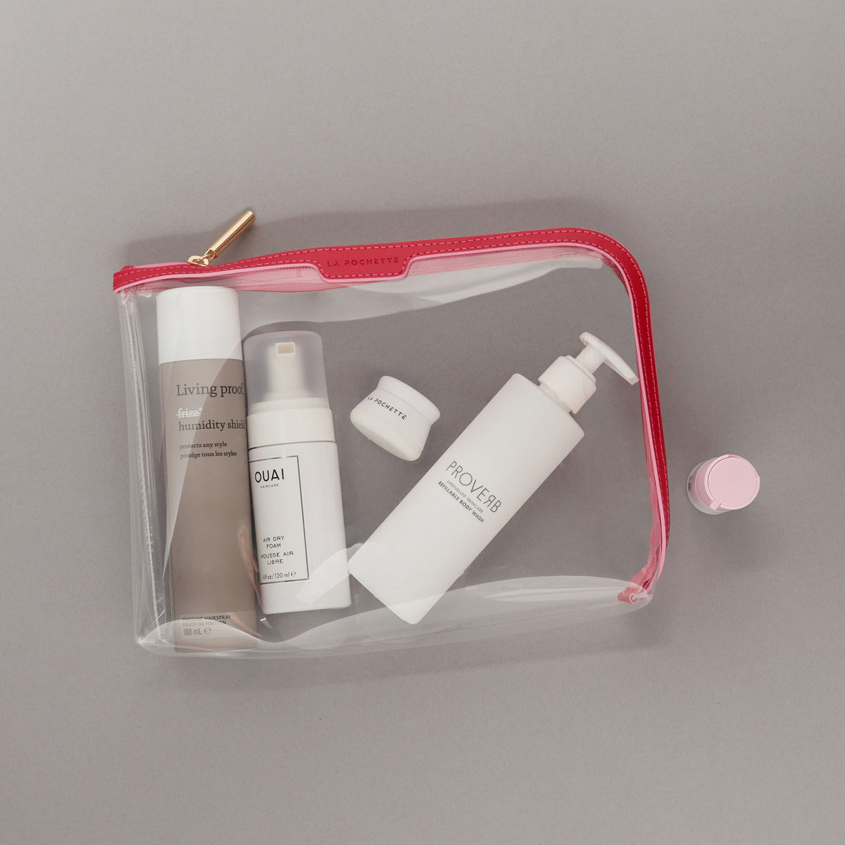 Large Anywhere Everywhere Pouch in Cashmere White colourway containing beauty accessories 