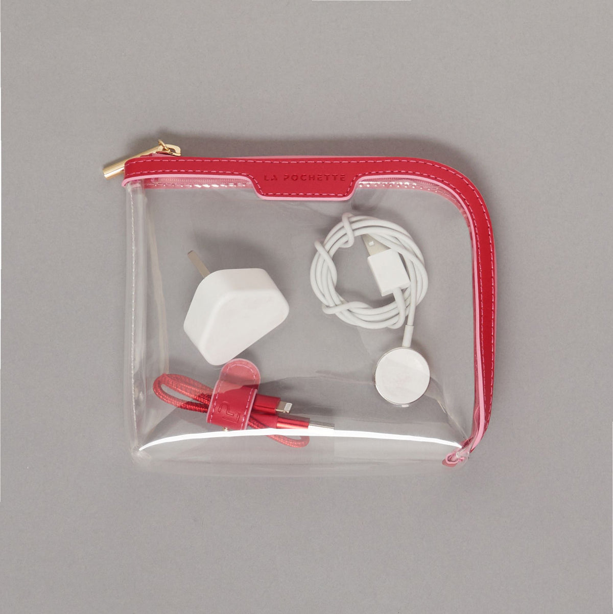 Small Anywhere Everywhere Pouch in Chilli Peony colurway containing Cable Tidy in Chilli Peony colurway and plug 