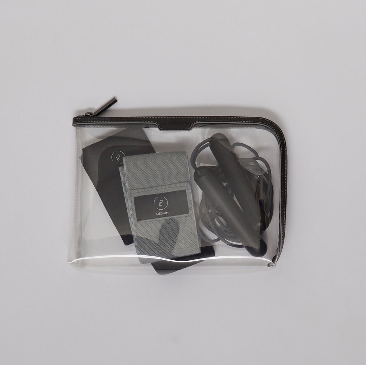 Large Anywhere Everywhere Pouch in Pewter Ink colourway containing resistance bands and Tanagram SmartRope