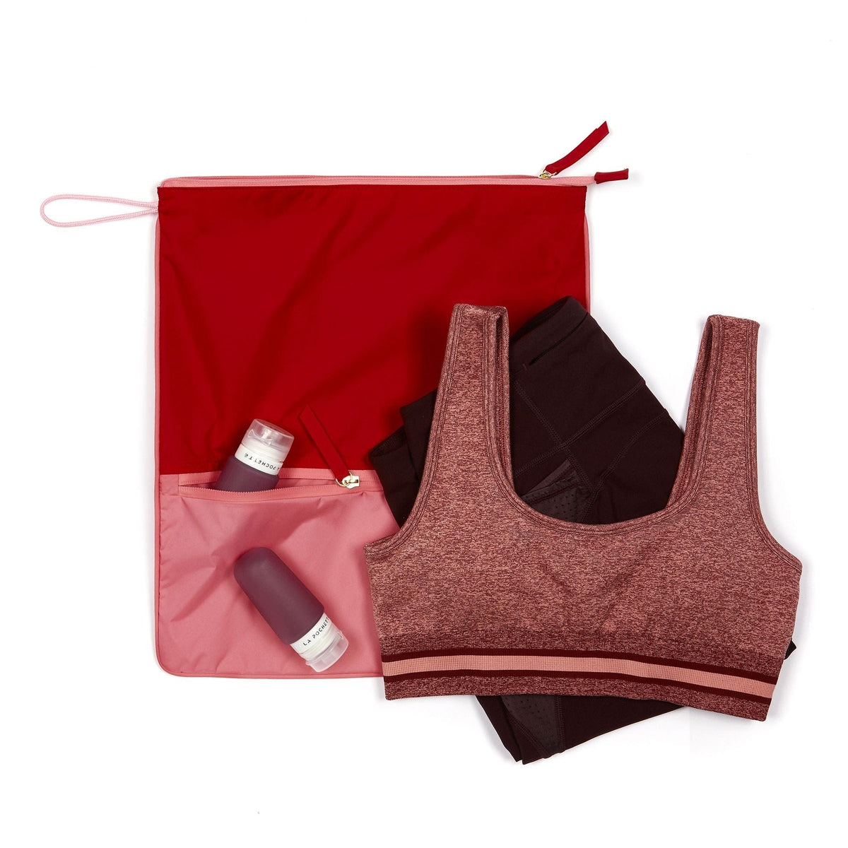Sweat Bag shown with gym kit, and post workout essentials, including the silicone travel bottles