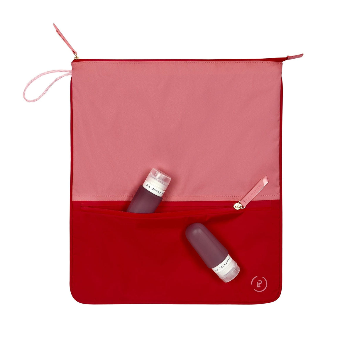 Sweat Bag in vibrant pink and red shown with two La pochette silicone travel bottles 