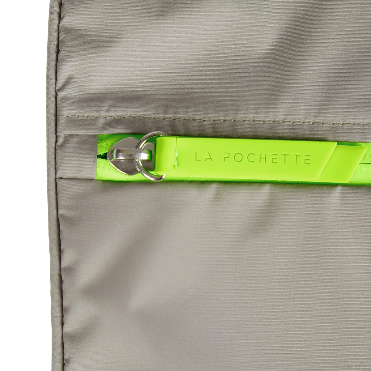 Close-up of the La Pochette neon green zip detail 
