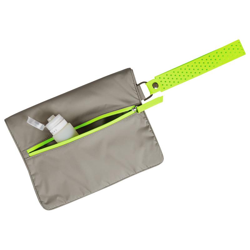 Rear view of Large Wet Bag in Walnut Neon Green colou way showing back zip pocket containing La Pochette silicone travel bottles 