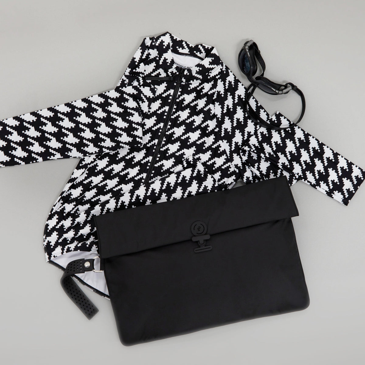 Maxi Wet Bag in black styled flat with a swimsuit and goggles